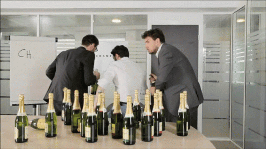 Three Men Holding A Champagne Bottle GIF