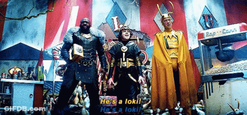 Three Men In Costumes Are Standing Next To Each Other In Front Of A Popcorn Machine In A Carnival . GIF