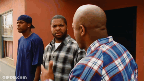 Three Men In Front Of Building One In Plaid Shirt GIF