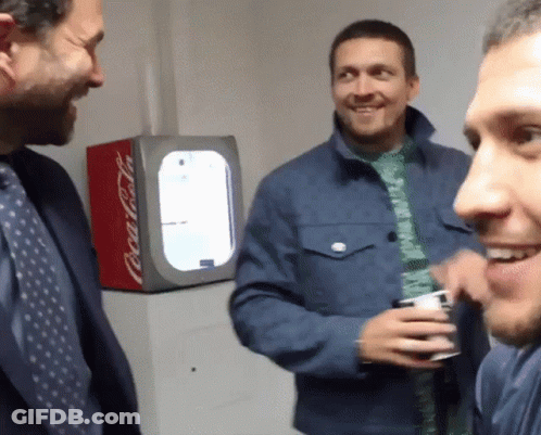 Three Men In Front Of Coca Cola Fridge GIF