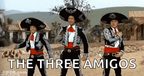 Three Men In Mariachi Costumes Are Standing Next To Each Other In The Desert . GIF