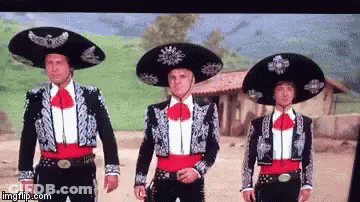 Three Men In Mariachi Costumes Standing Together GIF
