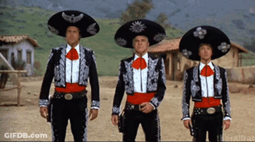 Three Men In Mariachi Outfits Stand In A Line GIF