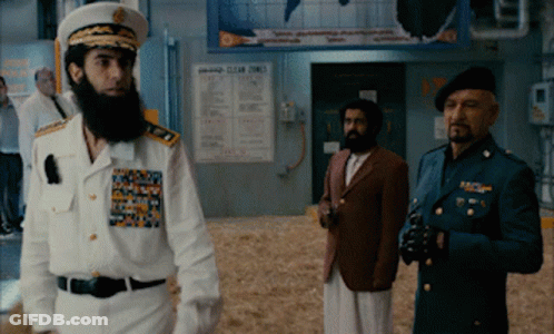 Three Men In Military Uniforms Standing In Front Of Clear Times Sign GIF