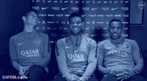 Three Men In Qatar Airways Shirts Sitting In Front Of Blue Backdrop GIF