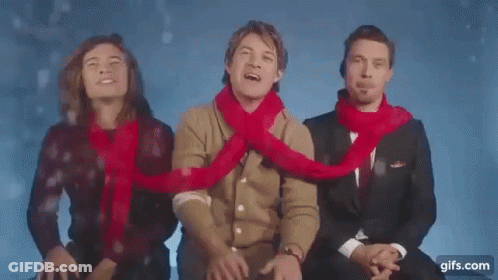 Three Men In Scarves Sitting Together GIF