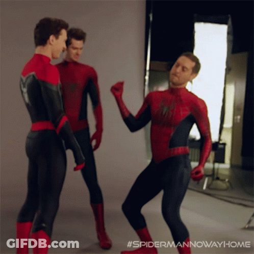 Three Men In Spider-Man Costumes Are Dancing Together GIF