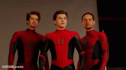 Three Men In Spider-Man Costumes Stand Next To Each Other GIF