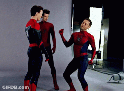 Three Men In Spiderman Costumes Are Dancing Together GIF