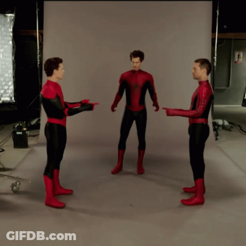 Three Men In Spiderman Costumes Are Standing In A Circle And Pointing At Each Other GIF