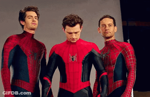 Three Men In Spiderman Costumes Are Standing Next To Each Other And Holding Hands . GIF