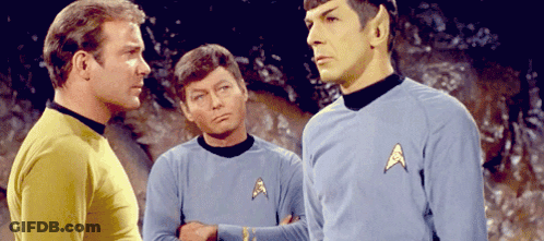 Three Men In Star Trek Uniforms Talking GIF