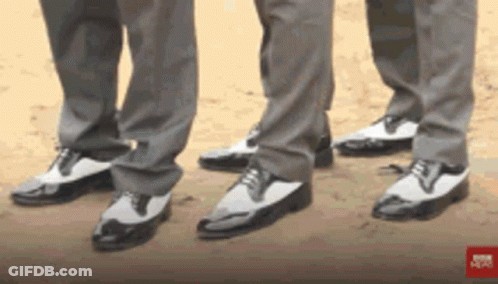 Three Men In Suits And Black And White Shoes GIF