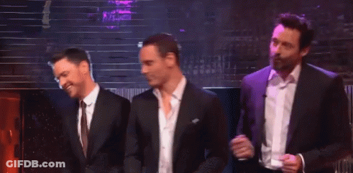 Three Men In Suits And Ties Are Dancing Together On A Stage GIF