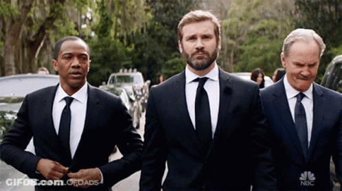 Three Men In Suits And Ties Are Standing Next To Each Other And The Nbc Logo Is Visible GIF