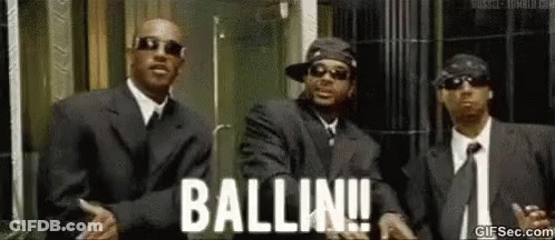 Three Men In Suits Dancing In Front Of Building GIF