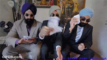 Three Men In Suits And Turbans Are Sitting In A Room GIF