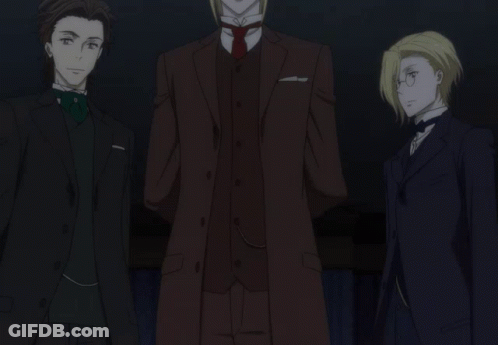 Three Men In Suits Are Standing Next To Each Other In The Dark GIF