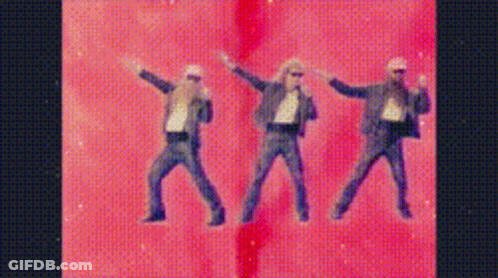Three Men In Suits Dancing On Pink Background GIF