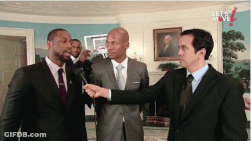 Three Men In Suits With Let's Move On Wall GIF