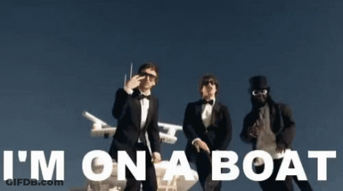 Three Men In Tuxedos Are Standing Next To Each Other With The Words I 'M On A Boat Written In White GIF