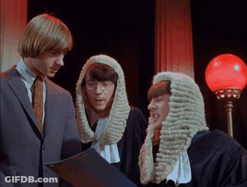 Three Men In Wigs Are Looking At A Book GIF