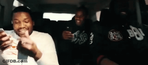 Three Men Looking At Phones In Back Seat GIF