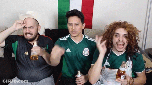 Three Men On Couch, One Wearing Green Adidas Jersey GIF
