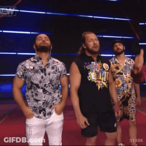 Three Men On Red Carpet In Front Of Starr Screen GIF