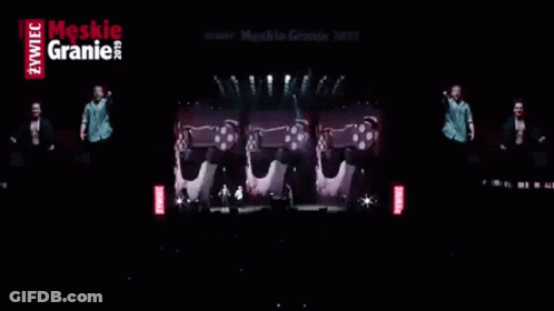 Three Men On Stage With Red Meskie Granie GIF