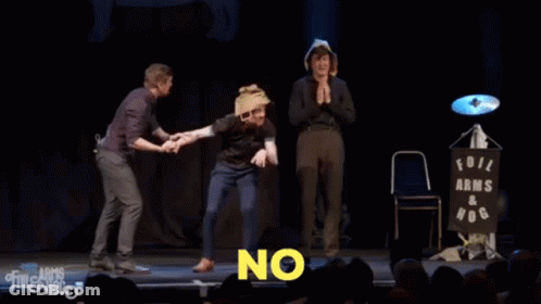 Three Men On Stage With The Words Let Him Die In Agony GIF
