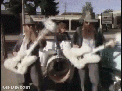Three Men Playing Guitars And Drums In A Band GIF