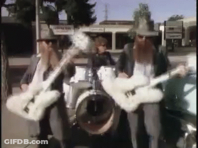 Three Men Playing Guitars And Drums In Band GIF