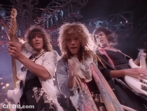 Three Men Playing Guitars And Singing On Stage GIF