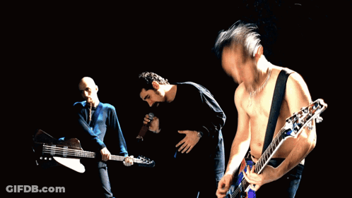 Three Men Playing Guitars In Front Of Crowd GIF