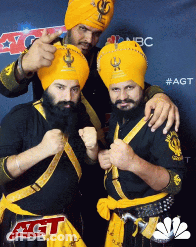 Three Men Posing In Front Of AGT Sign GIF