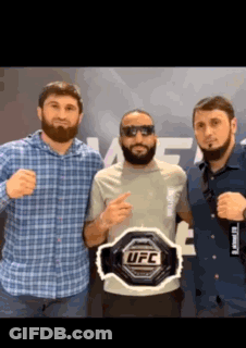 Three Men Posing With UFC Belt GIF