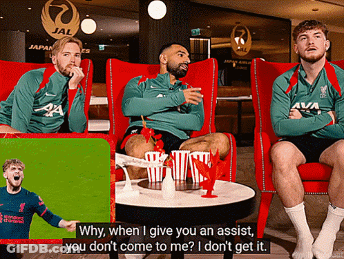 Three Men Red Chairs One Wearing Liverpool Jersey GIF