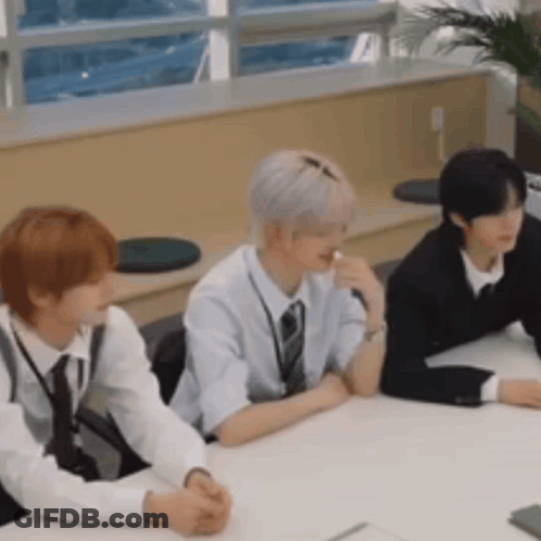 Three Men Sitting At Table GIF