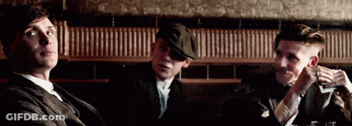 Three Men Sitting At Table One Smoking GIF