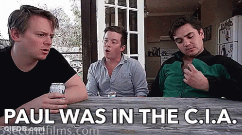 Three Men Sitting At Table Saying Paul Was In The C.I.A GIF