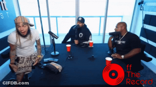 Three Men Sitting At Table With Ff The Record GIF