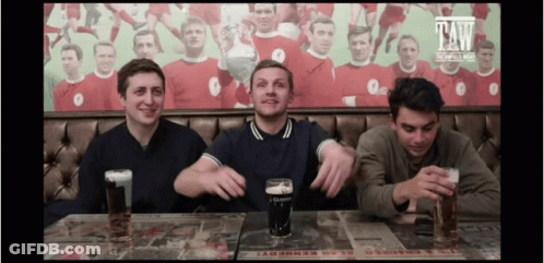 Three Men Sitting At Table With Guinness Beer GIF