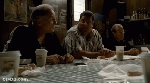 Three Men Sitting At Table With O'Reilly Cup GIF