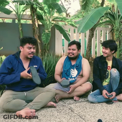 Three Men Sitting, One Wearing Hulk Shirt GIF