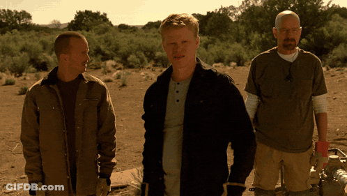 Three Men Standing In A Desert With One Wearing A T-Shirt That Says ' Abercrombie & Fitch ' On It GIF