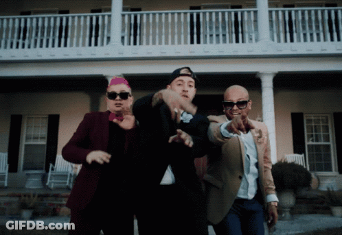 Three Men Standing In Front Of A House Pointing GIF