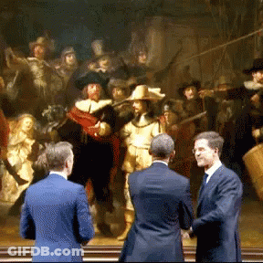Three Men Standing In Front Of A Large Painting GIF