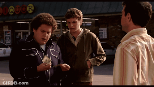 Three Men Standing In Front Of A Liquor Store Talking GIF