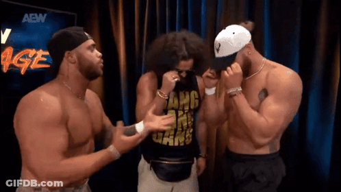Three Men Standing In Front Of AEW Sign GIF